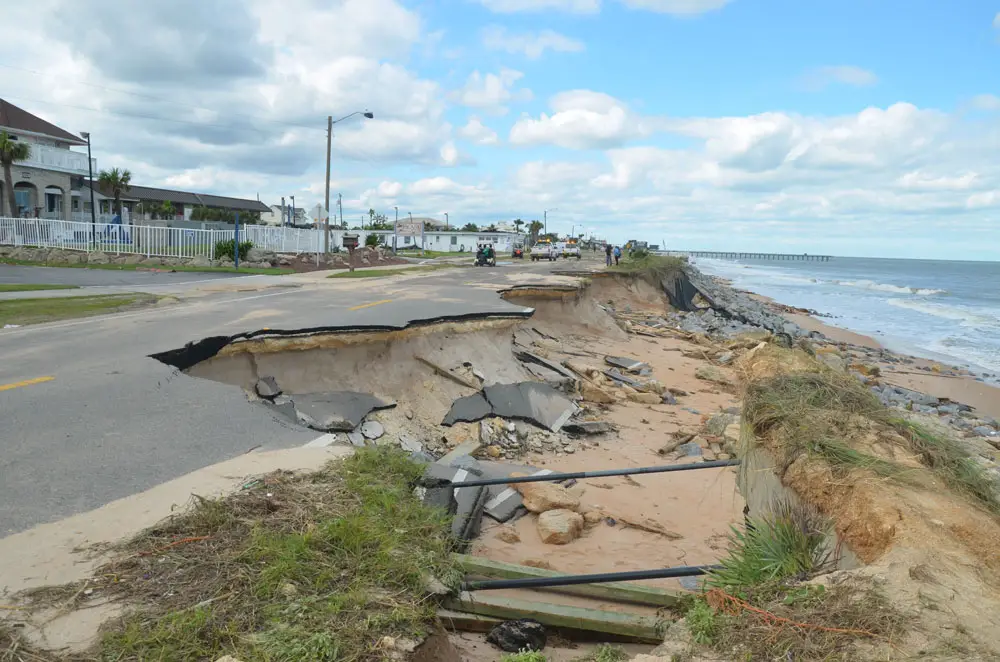 What Flagler County is hoping to prevent with a beach management plan yet to be written, or paid for. Above, Hurricane Matthew's demolition of the southern part of A1A in Flagler Beach. The state transportation department rebuilt the road at costs exceeding $30 million, including a temporary fix. The U.S. Army Corps of Engineers is set to rebuild the dunes along that way, at costs exceeding $25 million (including a state and local match). But there's no start date. (© FlaglerLive) 
