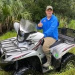 The Mosquito Control District's John Dunlop, riding a district ATV. An image of the stolen ATV he found is below. (East Flagler Mosquito Control District)