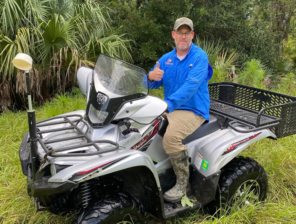 The Mosquito Control District's John Dunlop, riding a district ATV. An image of the stolen ATV he found is below. (East Flagler Mosquito Control District)