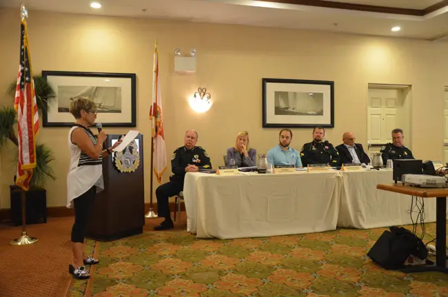 Lynne B. Rosewater, left, addresses the wrap-up meeting of a domestic violence task force at a meeting at the Hilton Garden Inn in Palm Coast Friday afternoon. Sheriff Rick Staly, second from left, convened the task force in June. Members of the task force included, from left, Carrie Baird, Jonathan Tanenbaum, Chris Ragazzo, Ed Reistetter and Jack Bisland, the undersheriff. (c FlaglerLive)