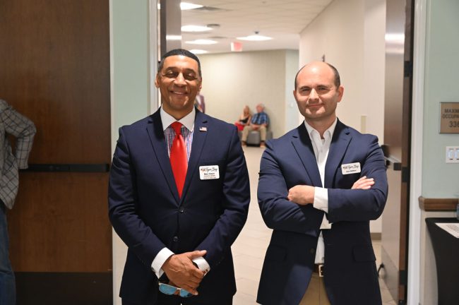 Marc Dwyer, left, and Brian McMillan, publisher of the Palm Coast Observer and a Tiger Bay member. (© FlaglerLive)