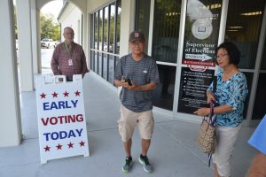 Early voters marked the occasion with a picture, (© FlaglerLive)