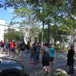 Turnout was brisk at the Flagler County Public Library on Palm Coast Parkway, one of five early-voting locations. The library location was the busiest this morning, with a line snaking around the sidewalk and halfway down the parking lot, toward the entrance. (© FlaglerLive)