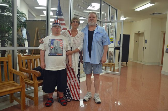 In an election season with few heroes, one stands out: the voter. Here was a family of voters who'd just cast their ballots early on Thursday, at the Supervisor of Elections office in Bunnell, with clothes to fit the occasion. From left, Alec, Gloria and Leonard Best, of Palm Coast. (© FlaglerLive)