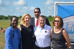 The team that landed Aveo: from left, Deputy County Attorney Sally Sherman, Economic Development Director Helga van Eckert, County Administrator Craig Coffey, Aveo's Christian Nielsen, and County Commission and Jobs Council Chairwoman Barbara Revels. Click on the image for larger view. (© FlaglerLive)