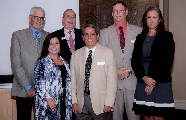 The Flagler Education Foundation is the school district's non-profit arm, fund-raiser and support organization, underwriting many scholarships and programs. The foundation installed its new officers at a banquet at Hammock Beach Resort Monday evening. From left, Dave Taylor, Treasurer, David Alfin, Secretary, Mike Beadle, President,  County Judge Melissa Moore-Stens, who  installed the Board but isn't a member,  Catherine Evans, Vice-President, and Joe Marotti; President-Elect. Joe Rizzo, the organization's executive director, is not in the picture, but was at the banquet. (Jason Wheeler)