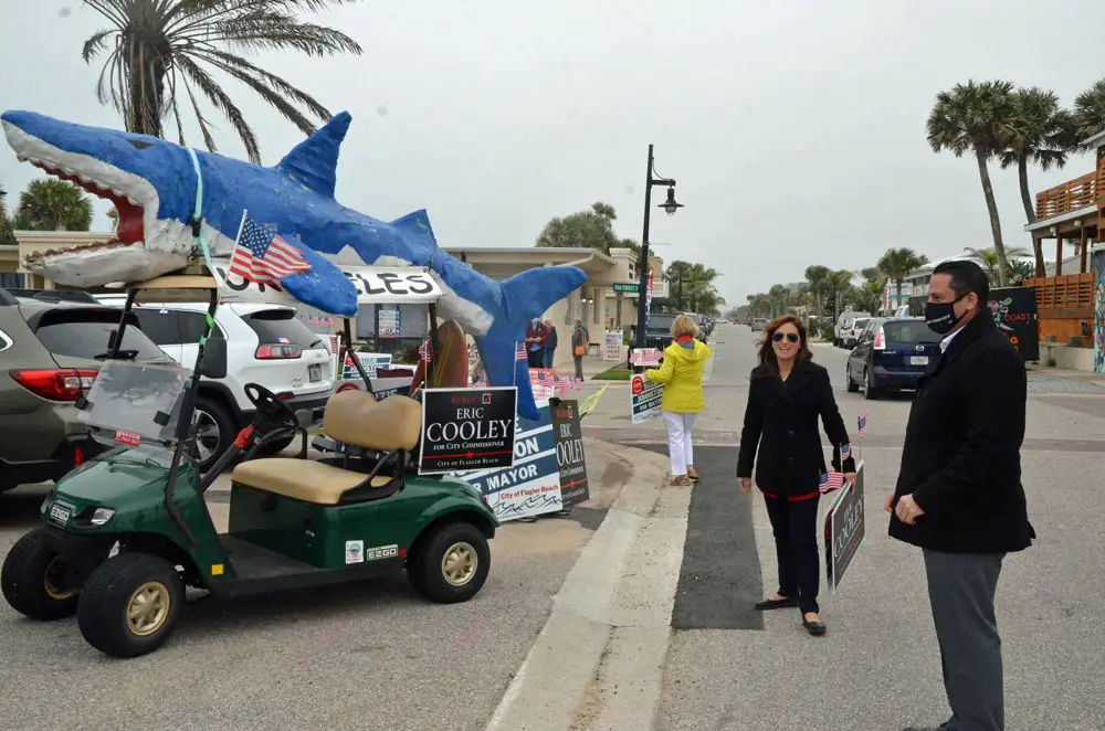 You never know what candidates will come up with as campaign props: last year Flagler Beach Commissioner Eric Cooley, who is not on the ballot this year, drafted a famous Flagler Beach shark as a campaign aid. (© FlaglerLive)