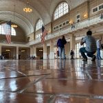 The great hall at Ellis Island, once thronged with immigrants, today is a tourist attraction. (© FlaglerLive)