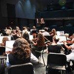 One of the Flagler Youth Orchestra's five ensembles in rehearsal just before a performance at the Flagler Auditorium last April. (© FlaglerLive)