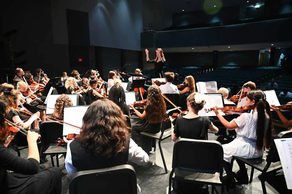 One of the Flagler Youth Orchestra's five ensembles in rehearsal just before a performance at the Flagler Auditorium last April. (© FlaglerLive)