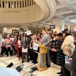 Joe Saunders of Equality Florida addresses a news conference at the Florida Capitol on Jan. 16, 2024. Flanking him, l-r, are Senate members Shevrin Jones and Tracie Davis. (Photo by Michael Moline/Florida Phoenix)