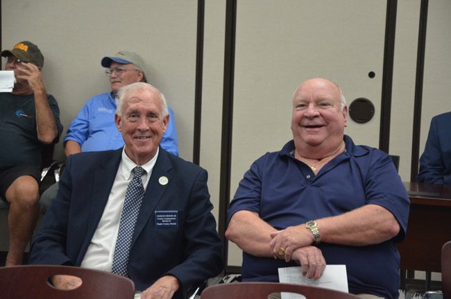 Old rivals, but not really: County Commissioner Charlie Ericksen, right, and former Palm Coast Mayor Jon netts at Friday's legislative delegation meeting at Palm Coast City Hall. Ericksen challenged Netts for the Palm Coast mayorship in 2011, lost, then won a seat on the County Commission in 2012, and won re-election last year. (© FlaglerLive)