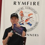 Erik Jones on Friday, doing one of his favorite things away from the track: reading to children. (© FlaglerLive)