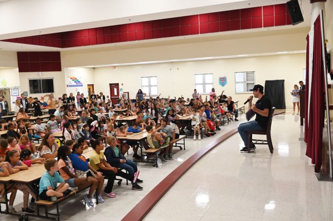 Erik Jones read "Goodnight Racetrack" to the first group of students at Rymfire Elementary. (© FlaglerLive)
