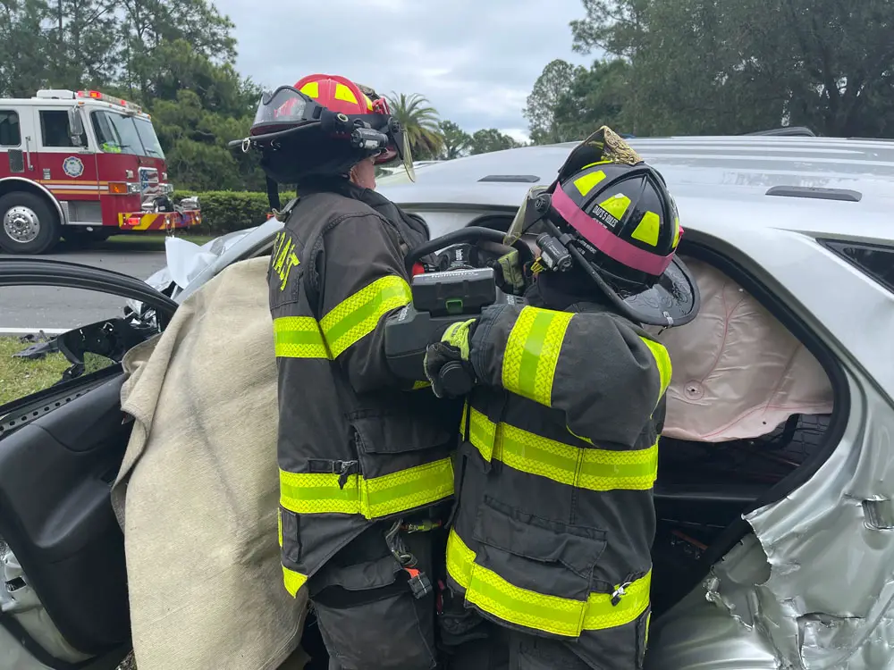 Palm Coast Fire Department crews in the middle of one of the extrications at today's crash. (Palm Coast Fire Department)