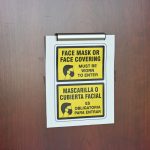 Signs about mandatory face-masking were still posted at the Flagler County courthouse last week, but in the courtrooms, judges were relaxing the rules.. making masks optional. (© FlaglerLive)