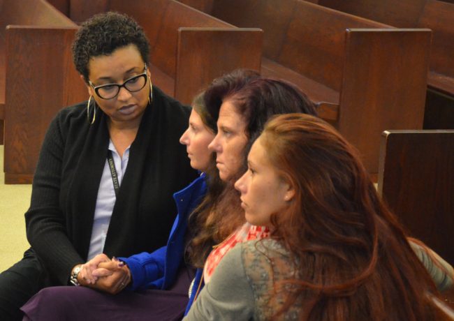 Tiffany Norman, second from left, with the victim's advocate, her mother and her sister shortly after the verdict. (© FlaglerLive)