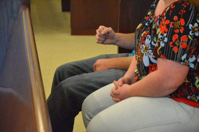 A family member to one of the victims pumped his fist as the verdict was read and the jury polled. Click on the image for larger view. (© FlaglerLive)