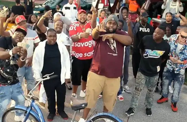 A still from a music video shot in Bunnell by the rapper known as FatAss, center in the foreground. The production triggered an effort by Bunnell government to regulate video and other movie productions in the city.