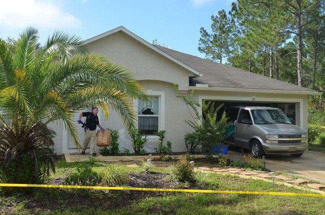 An FDLE crime lab leaving Leonard Lynn's home this morning. Click on the image for larger view. (© FlaglerLive)