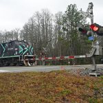 A Florida East Coast train speeding past the County Road 304 crossing this morning., hours after a man died there in an apparent suicide. (© FlaglerLive)