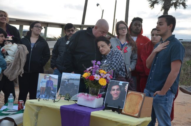 Anthony Fennick's brother Dan, right, spoke during a vigil in remembrance of Anthony, who died Saturday at age 23. His mother Erika Williams, with her husband Dan, center, pledged to start an advocacy organization called 'Inmates Are Human Too.' (© FlaglerLive)