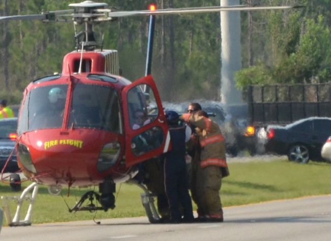 Flagler County Fire Flight in action last Thursday, picking up a trauma patient after a motorcycle wreck on U.S. 1. Click on the image for larger view. (© FlaglerLive)