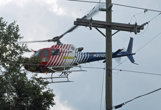 Fire Flight, Flagler County Fire Rescue's helicopter, flew Kathy McDonald to Halifax Hospiotal Friday evening after her husband drover her to the intersection of County Road 302 and County Road 305. This is a file photo of Fire Flight. near the Mondex last April. (© FlaglerLive)