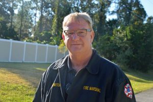 Flagler County Fire Marshal Jerry Smith had been up most of the night at the scene. (© FlaglerLive)