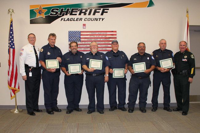 From Palm Coast Volunteer Fire and Rescue: 'The Palm Coast Fire Police were recently honored by the Flagler County Sheriff's Office & Sheriff Rick Staly. The Palm Coast Fire Police assist with traffic control at motor vehicle crashes, fire scenes and emergency incidents. This selfless group of volunteers respond to over a thousand calls for service a year. We appreciate their commitment and dedication.' From left, Fire Chief Michael Beadle, Lt. Rick Stevens, Vinny DeVita, Robert Hudak, Jack Ogden, Felix Lucas Ramos, Captain Steve Garnes, and Sheriff Rick Staly. (Facebook)