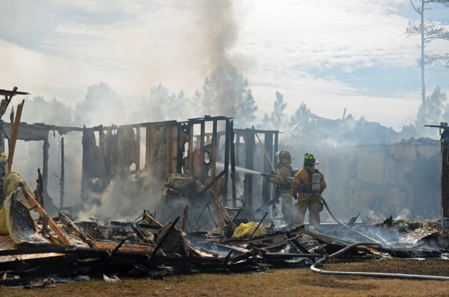 Firefighters battled what remained of Ron Walker's house in Rima Ridge. Click on the image for larger view. (c FlaglerLive)