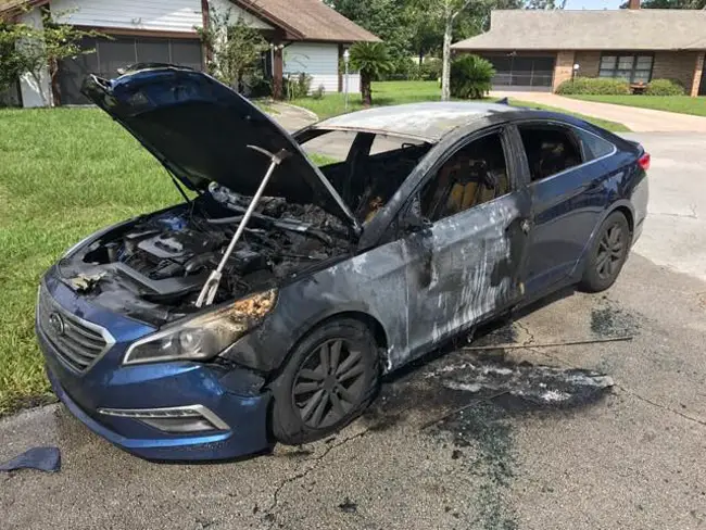 The Hyundai, in front of a house on Blare Court, was intentionally incinerated by individuals believed to be connected to this morning's armed robbery at Walgreens on Palm Coast Parkway. 