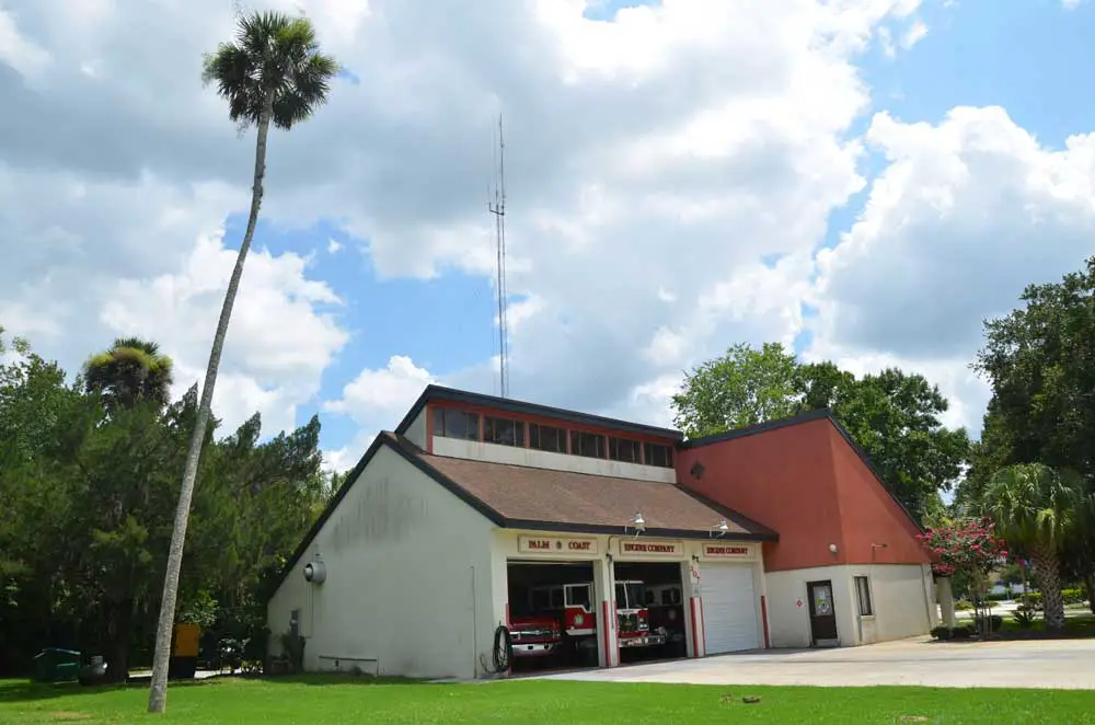 The days of Palm Coast Fire Station 22, built in 1977, are drawing to a close. The grounds could be converted into a parking lot to accommodate overflow from the Community Center nearby. But an adjoining parcel could also do the job. (© FlaglerLive)