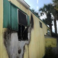 The fire destroyed a back bedroom at the doublewide trailer. Click on the image for larger view. (Flagler Beach Fire Department)