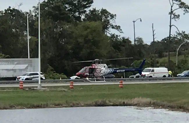 Flagler County Fire Flight, the emergency helicopter, landed on the southbound lanes of I-95 Monday afternoon to take Daniel R. Macleod to Halifax hospital in Daytona Beach. (© FlaglerLive)