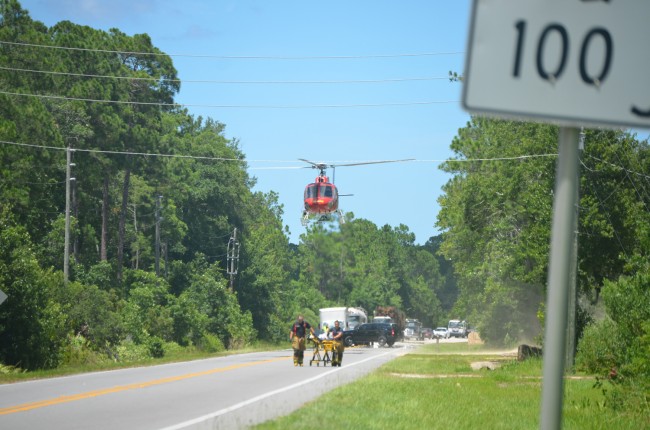 Flagler County Fire Flight takes off from its improvised landing zone on State Road 100, with Jerry Culver aboard. Click on the image for larger view. (© FlaglerLive)