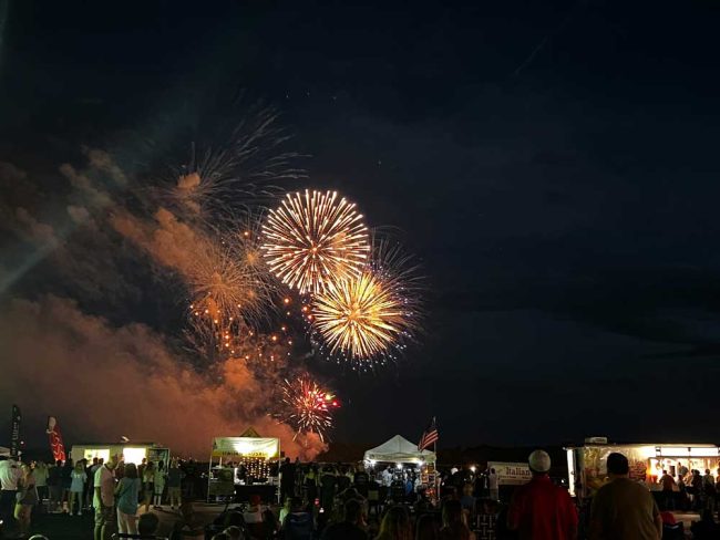 Last year's Fireworks Over the Runway show at the county airport, illuminating the numerous vendors. (Palm Coast)