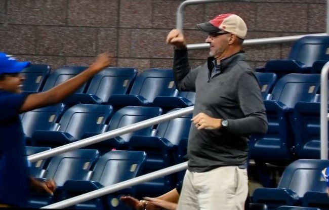 Fist-bumping in the stands from a man who looks suspiciously like Mike Opelka, Reilly's uncle and the Delaware radio host. (© FlaglerLive via ESPN)