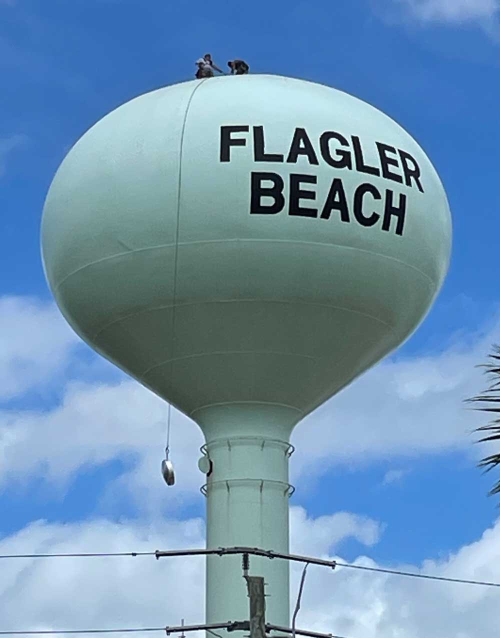 Flagler Beach was in repair mode all the way to its water tower today. (© Rick Belhumeur for FlaglerLive)
