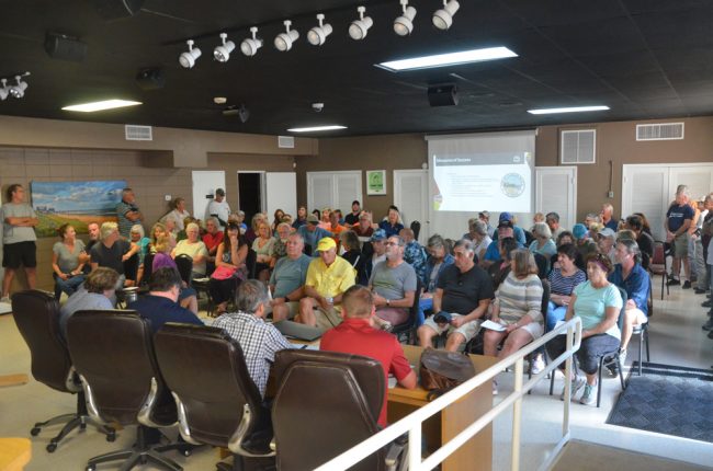 Some 100 people filled City Hall's commission chamber this afternoon for an informational meeting on the swale-digging project at the south end of town. (© FlaglerLive)