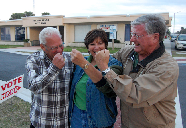 From left, Marshall Shupe, Kim Carney and Phil Busch, Flagler Beach's three candidates for two city commission seats, less than two hours before polls closed Tuesday afternoon. They were in a witty mood. (© FlaglerLive)