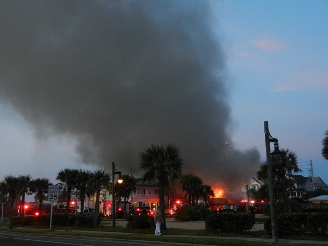 The dawn fire at the Seaside Shoppe was captured by Sherry Baker. (© Sherry Baker for FlaglerLive)