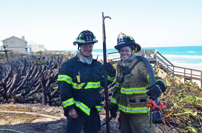 Who says they're short-handed at the Flagler Beach Fire Department? Firefighters Dustin Snyder, who's been with the department two and a half years, and Morgan Walden, a volunteer recently elevated to full-time status, were on the job Thursday afternoon. Click on the image for larger view. (© FlaglerLive)