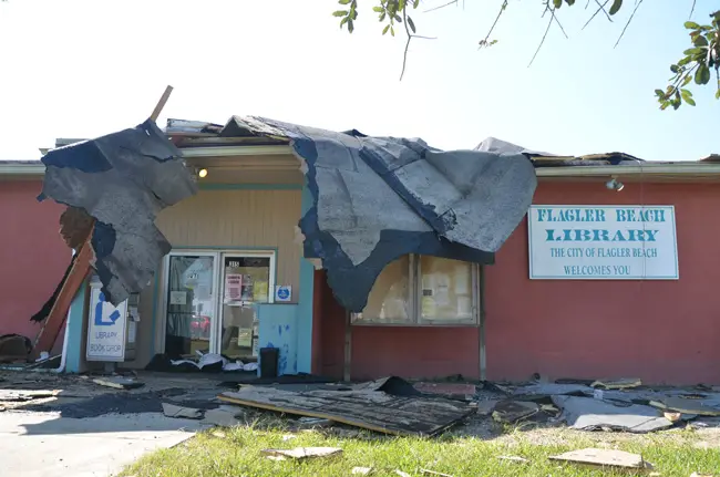 The Flagler Beach Public Library had been closed since Hurricane Matthew last year, for repairs. It was to open later this month. Not anymore. Its roof was torn out by Hurricane Irma. (c FlaglerLive)