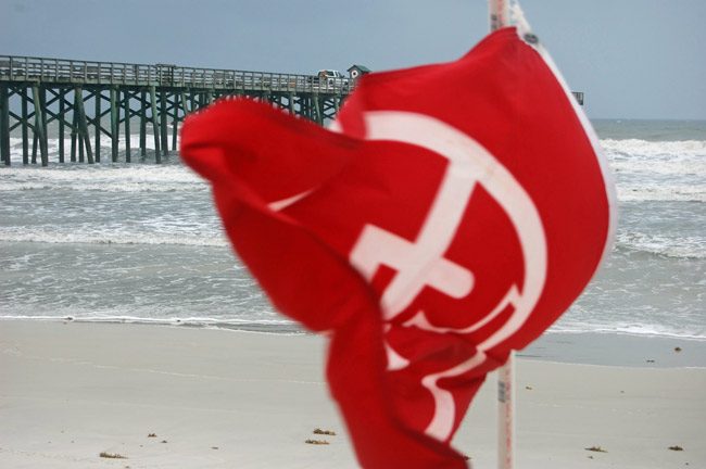 There will be a total of 14 lifeguards instead of 30 in Flagler Beach this summer season after the city cut $100,000 out of its budget. (© FlaglerLive)