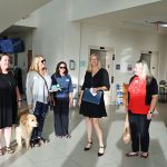 Flagler Cares CEO Carrie Baird, second from right, after a proclamation marking Flagler Cares' 10th anniversary, at a Bunnell City Commission meeting in June. All local governments adopted the proclamation. (© FlaglerLive)