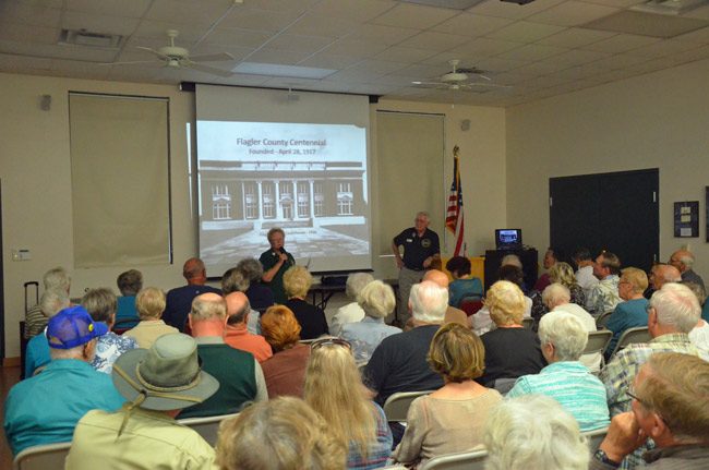 Last week's talk by Sisco Deen, right, focused on Jack Clegg's history of the county, launched the annual Flagler Reads Together events in conjunction with the county's centennial celebrations. Friends of the Library President Terry Jones introduced Deen at the standing-room-only event at the Flagler County Public Library. (© FlaglerLive)