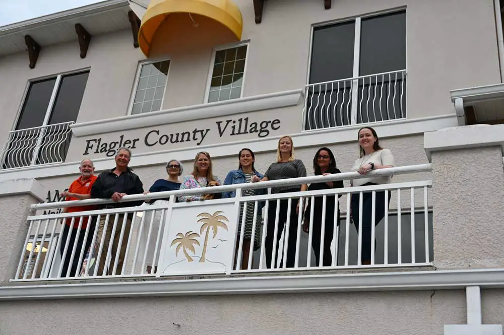 The Flagler Cares team at Flagler County Village. From left, Bob Snyder, Dr. Stephen Bickel, Jeanette Simmons, DJ Lebo, Danielle Geiger, Carrie Baird, Rachel Gerow, and Kajsa Lebo. (© FlaglerLive)