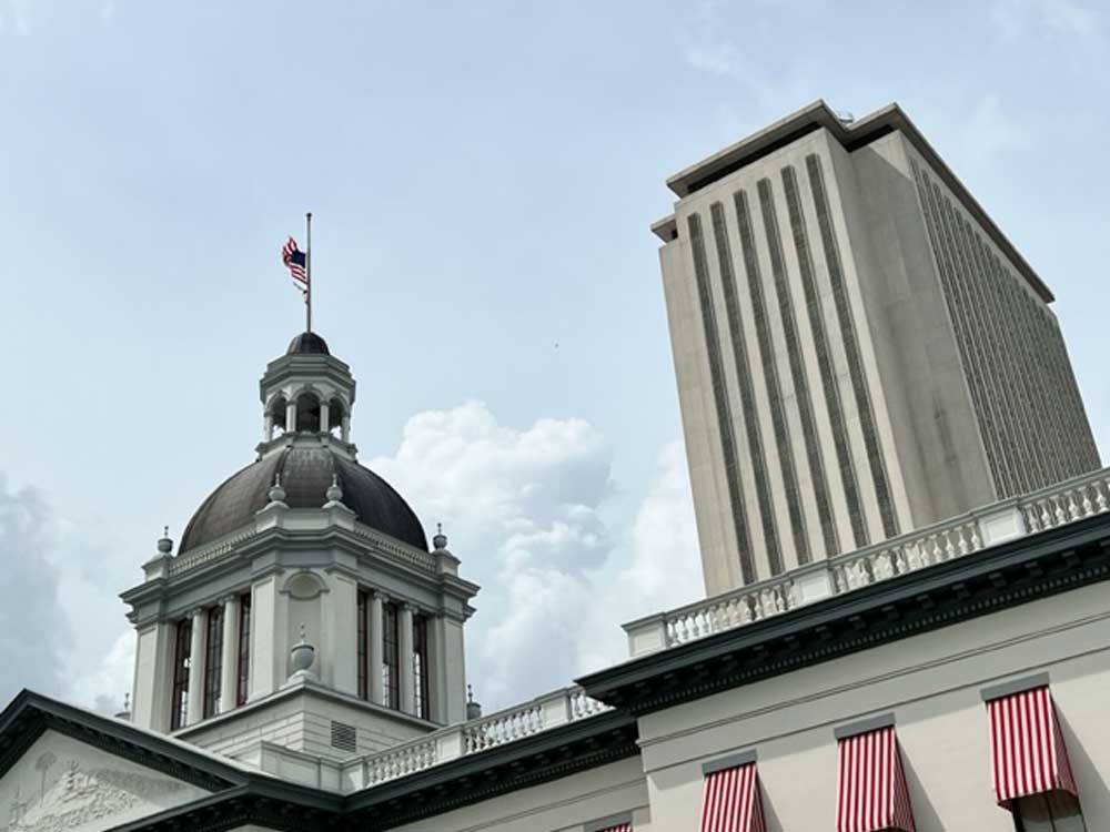 Flags flying at half-staff over the Florida Capitol.  (Michael Moline)