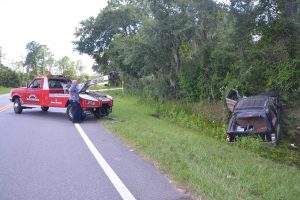 Jimmy Flynto, owner of Saxon's Towing, at the scene of a wreck. Click on the image for larger view. (© FlaglerLive)